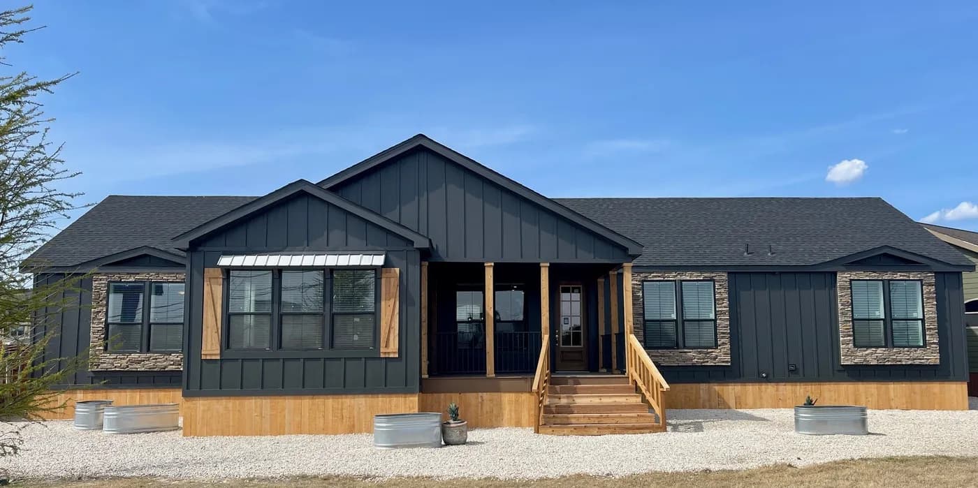 Modern manufactured home with stone accents and covered porch